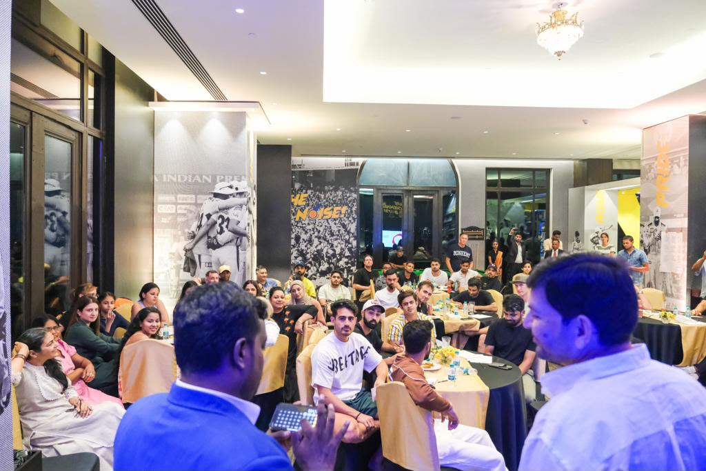 Kalai performing a stage show for a corporate audience