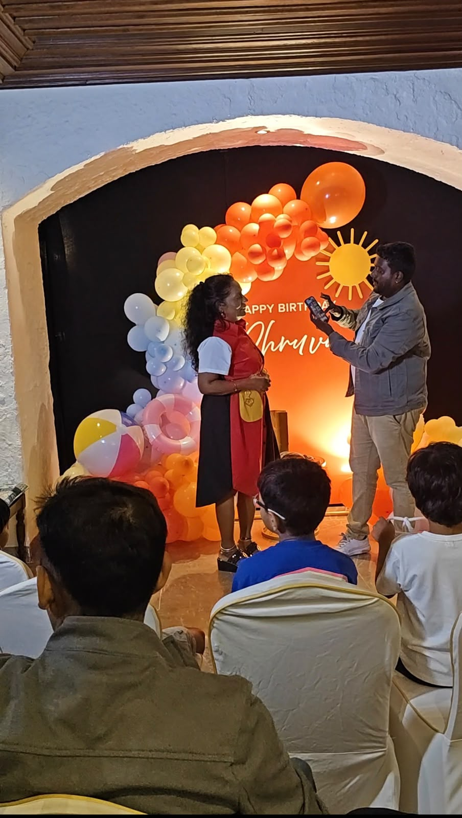 Kalai performing magic at an 8th birthday party