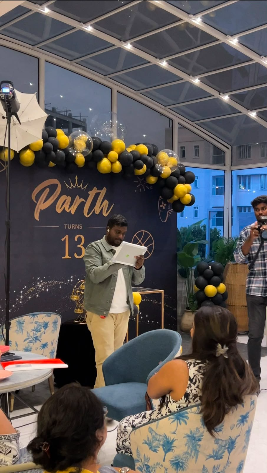 Kalai performing magic at a 13th birthday celebration